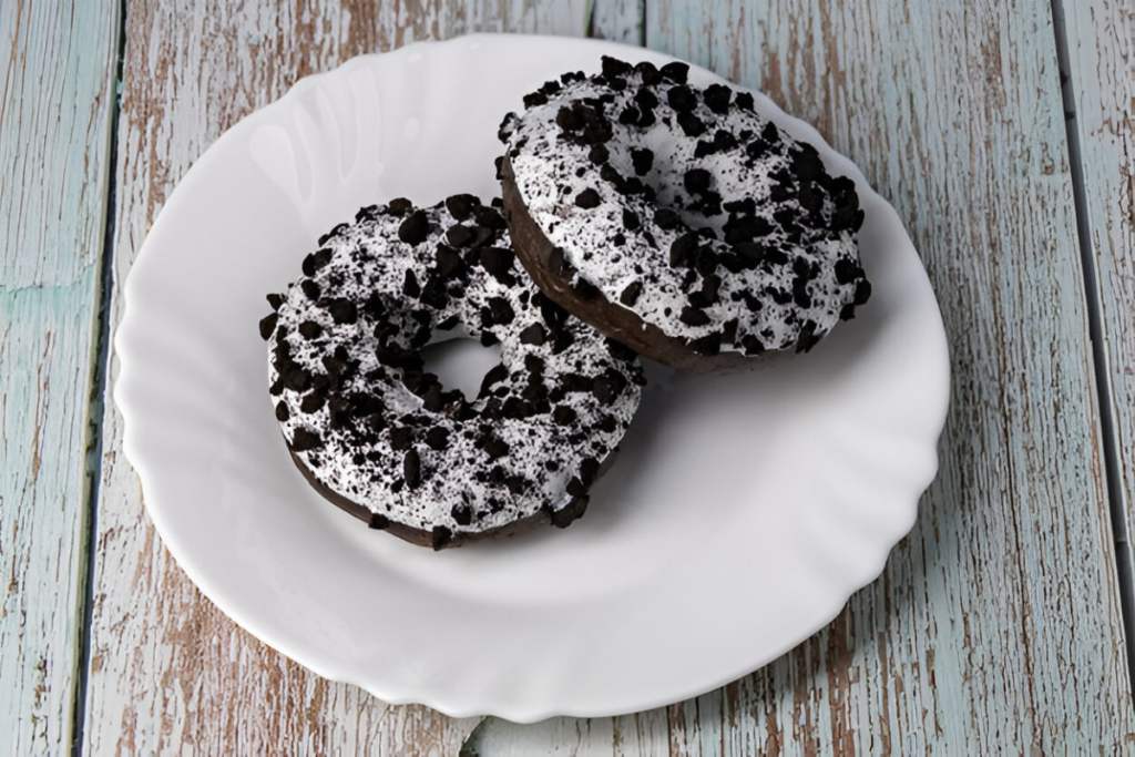 Close-up of a delicious Oreo donut with a glossy glaze and Oreo crumble, symbolizing indulgence and flavor.