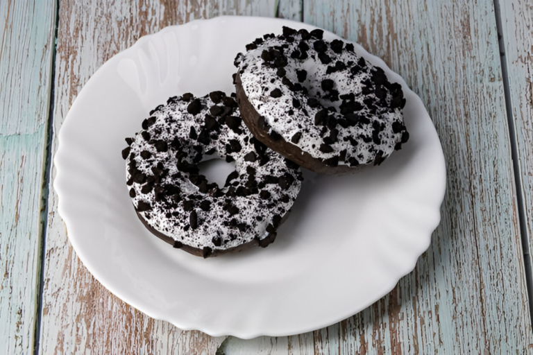 Close-up of a delicious Oreo donut with a glossy glaze and Oreo crumble, symbolizing indulgence and flavor.